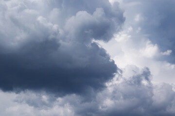Naklejka na ściany i meble dramatic rainy cumulus clouds background
