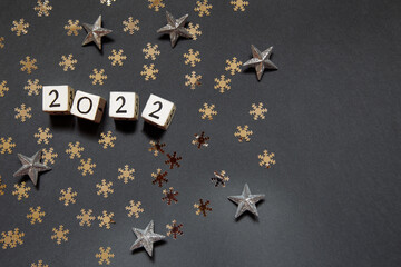 Happy new year 2022 white cubes with numbers and gold stars
