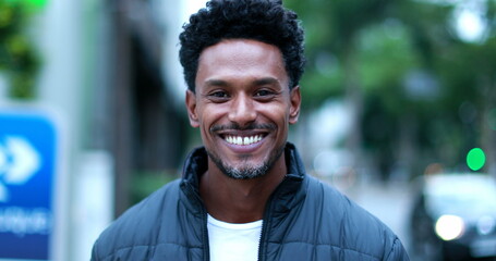 Young black African man portrait outside in city