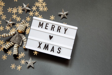 Christmas gray photophone with a sign with the inscription, snowflakes, stars and elf