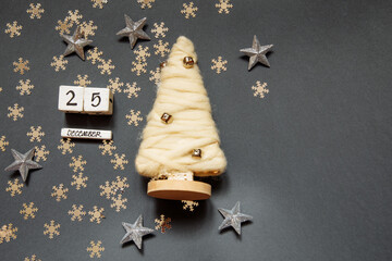 Happy New Year 25 December white cubes with numbers and gold stars and a Christmas tree