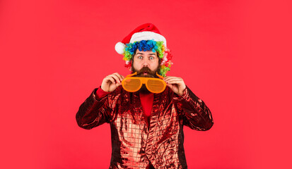 Happy New 2021 Year. Christmas party time. bearded santa claus in hat. celebrate the party. ready for xmas gifts and presents. mature man in glasses red background. new year shopping discounts