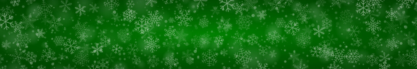 Christmas banner of snowflakes of different shapes, sizes and transparency on green background © Aleksei Solovev