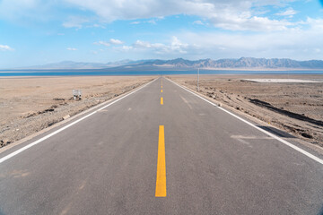 road in the desert to the lake 