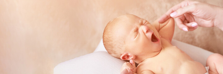 Tiny newborn. Mother touch little people. Healthcare massage concept. Modern parenthood. Comfort and safety sleep on knees. Human insurance. Family miracle. Closed eyes and yawn. Copyspace. Banner