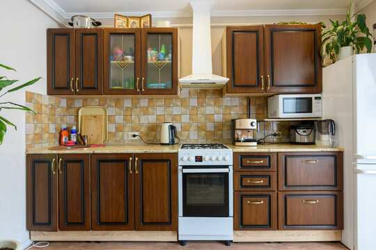 Kitchen Set For Dark Wood In A Standard Apartment