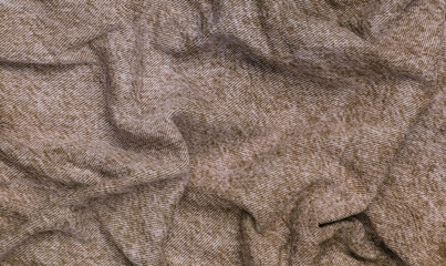 Crumpled red jeans texture close up. Denim background