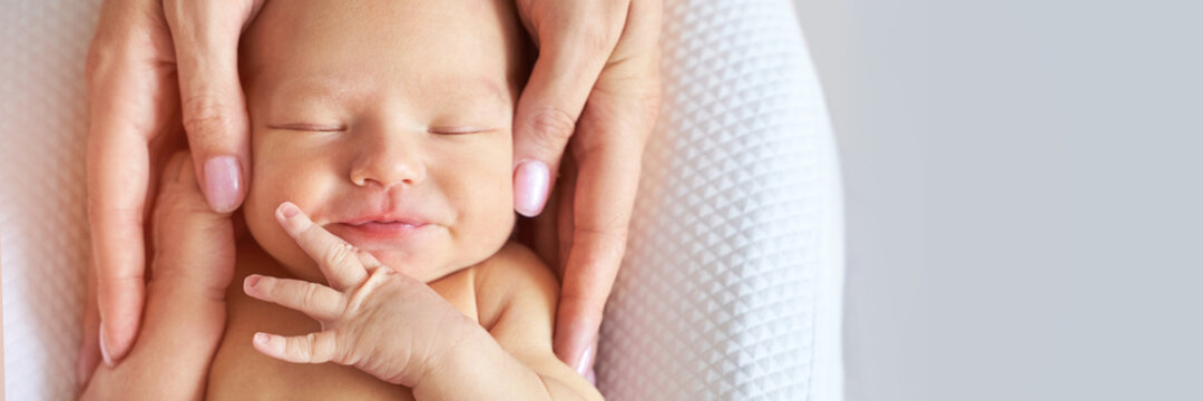 Newborn tiny head. Mother touch little people. Healthcare massage concept. Modern parenthood. Comfort and safety sleep on bed. Human insurance. Family miracle. Closed eyes. Banner. Copyspace