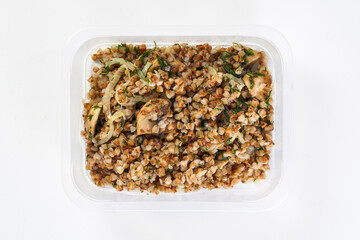 Buckwheat with mushrooms in a lunch box. Healthy lunch to go
