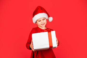 Best time. big christmas sale. child santa hat hold gift box. boxing day concept. all i dream about. happy new year. winter holiday and xmas joy. seasonal shopping discount. small girl carry present