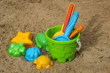 Fototapeta na wymiar Children's beach sand toys. Kids concept. Plastic children's toys.
