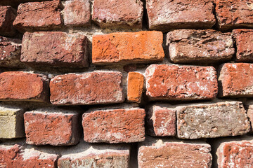 Fototapeta premium Old brick wall of a building, background, texture, pattern.