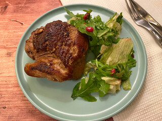 Grilled beef fillet  steak with green salad, vinaigrette and pomegranate seeds.