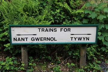 A platform sign showing destination for trains at the Abergynolwyn Station, Gwynedd, Wales, UK.