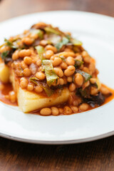 Swiss chard and beans served on polenta