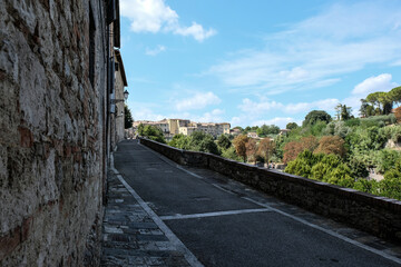 Authentic street with view in small village in tuscany in Italy