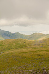 Fototapeta premium View from Ranger Path at Llanberis Path with a mountain train route to the Yr Wyddfa peak - foreland of Snowdon. Highest mountain range in Wales.
