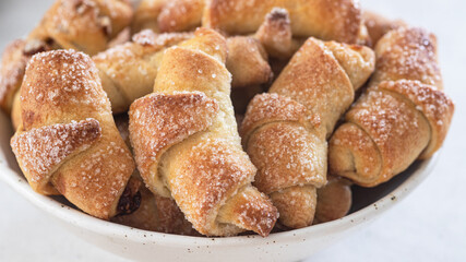 Rugelach with jam filling on plate 