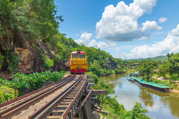 Fototapeta premium trains running on death railways track crossing kwai river in kanchanaburi thailand this railways important destination of world war II history builted by soldier prisoners