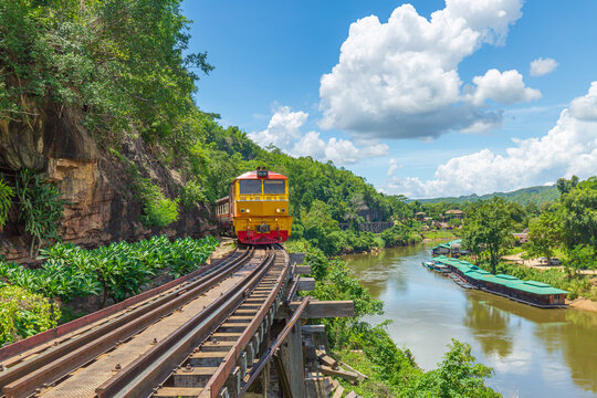 trains running on death railways track crossing kwai river in kanchanaburi thailand this railways important destination of world war II history builted by soldier prisoners