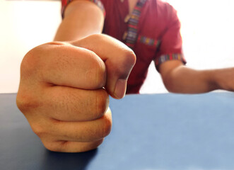 man slamming his fist on a table, man with fist, Hand on the table, angry man fists on the table