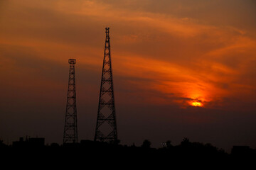 sunset view with two telecommunication tower