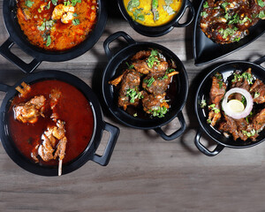 Assorted indian food on wooden background. Dishes and appetizers of indian cuisine