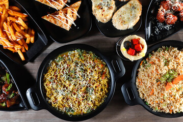 Assorted indian food on wooden background. Dishes and appetizers of indian cuisine