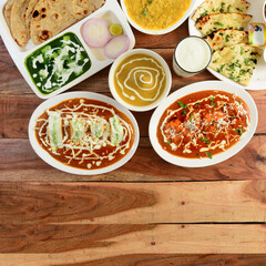 Assorted indian food on wooden background. Dishes and appetizers of indian cuisine