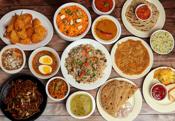 Assorted indian food on wooden background. Dishes and appetizers of indian cuisine