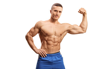 Strong muscular guy flexing bicep muscle topless and looking at camera