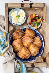 Plate with Burek, eggs and salad . Mediterranean style breakfast