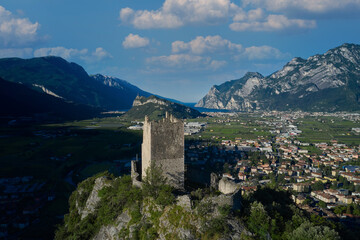 Fototapeta na wymiar Aerial view Riva del Garda. Arco Medieval Castle on the top of the rock. Arco Medieval castle, Trentino, Italy.