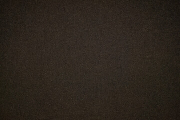 A dense industrial sheet of grey paper with a textured surface