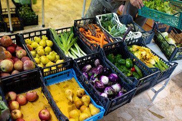 At the greengrocer, fruits and vegetables in the basket. Seasonable fruit and vegetables at the market. Close up shot