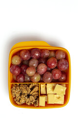 Food in Plastic containers ready to eat with Cheese, grapes and nuts