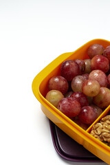 Food in Plastic containers ready to eat with Cheese, grapes and nuts
