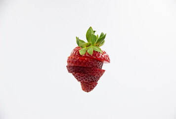 93 - Strawberry fragmented and suspended in space on a light background