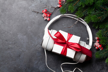 Christmas greeting card with headphones and gift box