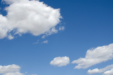 Obraz na płótnie Canvas White clouds on a blue sky. Background.