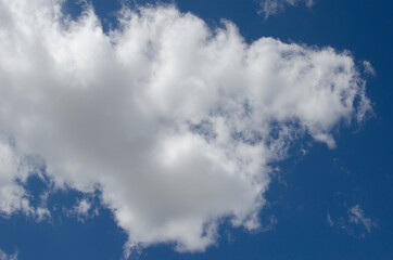 Obraz premium White clouds on a blue sky. Background.