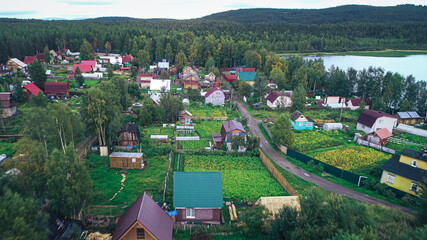 Fototapeta na wymiar Aerial Townscape of Suburban Village Fedoseevka located in Kandalaksha Area in Northwestern Russia on the Kola Peninsula