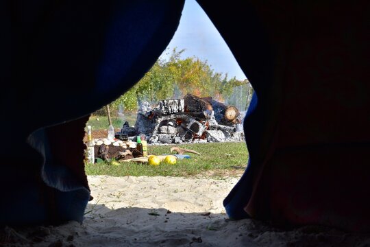 View from inside the inipi of the bonfire and offerings.