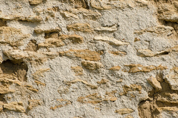 The texture of the old wall of natural stone.