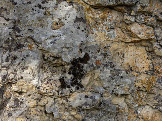Natural mountain stone,a section of rock texture on a Sunny day.
