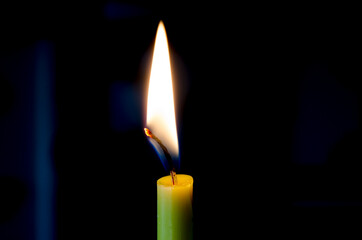 Candle flame on a black background.