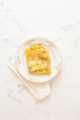 Italian lasagna with Bronte's pistachio pesto, a typical pesto from Sicily, southern Italy.