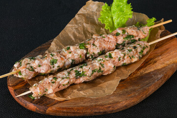 Raw minced pork skewer kebab for grill