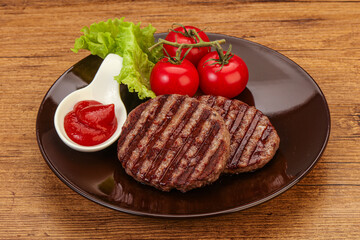 Grilled burger cutlet with sauce