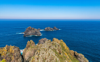 View of Aguillons rocks or islands emerging from the ocean at Cape Ortegal in the Galicia region of Spain.
